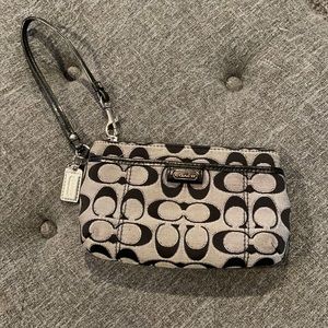 Black and grey Coach wristlet